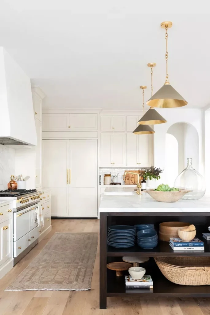 a beautiful kitchen with Benjamin Moore's Swiss Coffee color on its cabinets