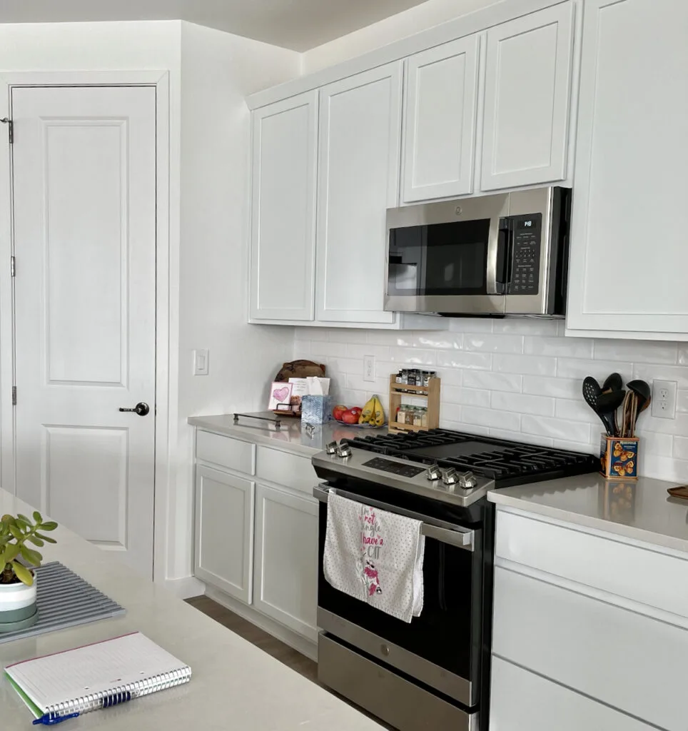 A beautiful kitchen with cabinets having Sherwin Williams Pure White (SW 7005)