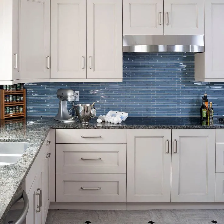 Kitchen with glass tiles backsplash and granite countertop