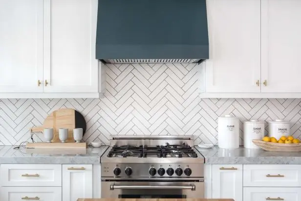 A beautiful kitchen with beautiful white backsplash