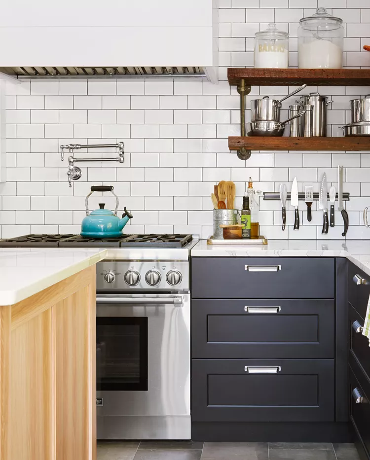 A modern kitchen with Classic white subway tiles Backsplash with dark gray or black grout