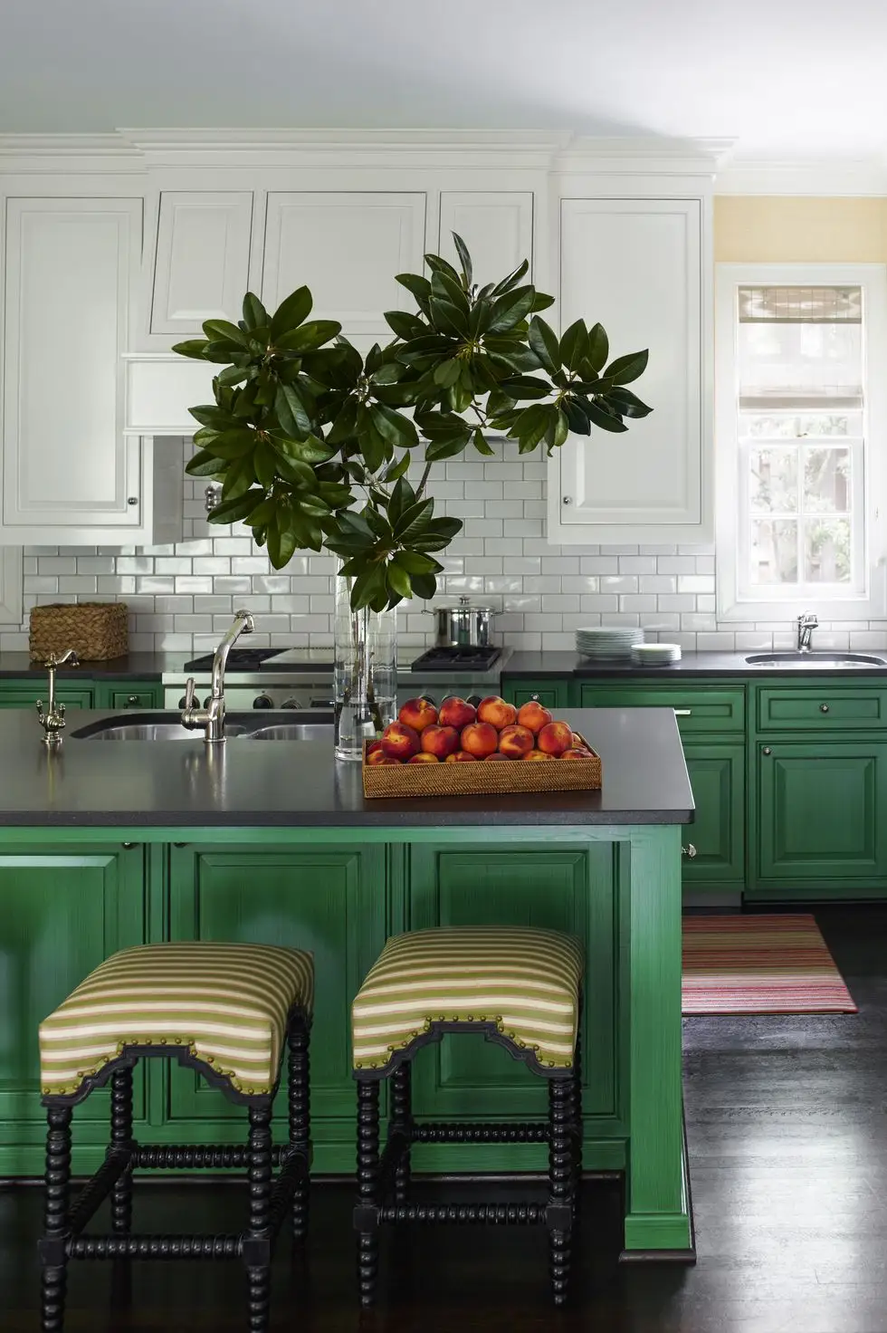 Clover Green Kitchen Cabinets with clover green paint on the kitchen island with off-white top cabinets.