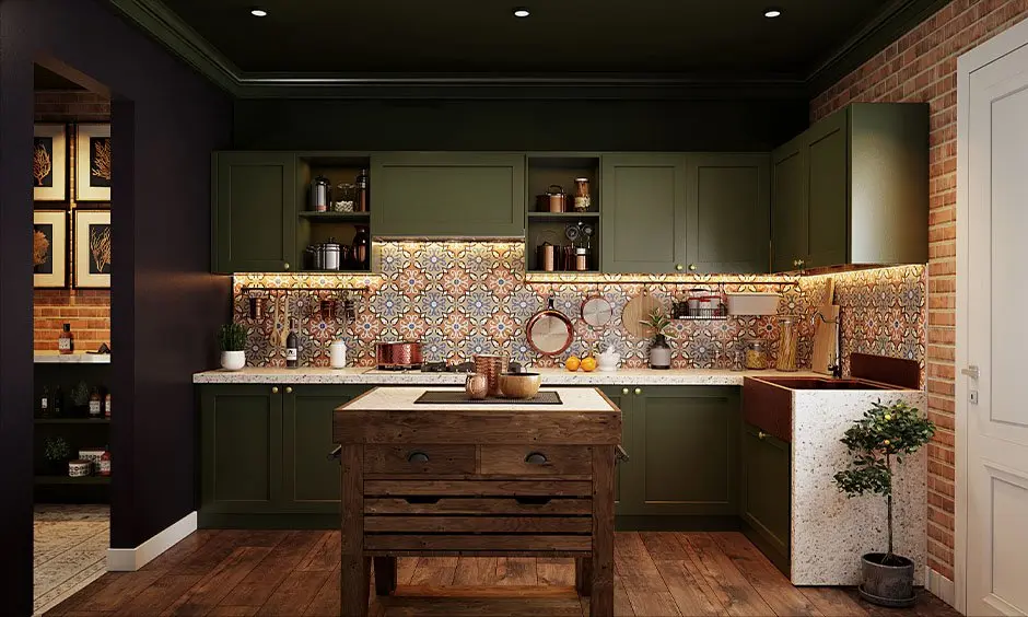 A modern kitchen with Dark Green Cabinets and gold-toned handles