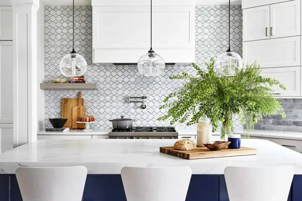 Beautiful kitchen with white countertop and tile backsplash