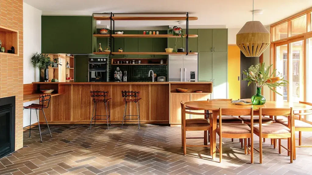 A beautiful kitchen with green cabinets