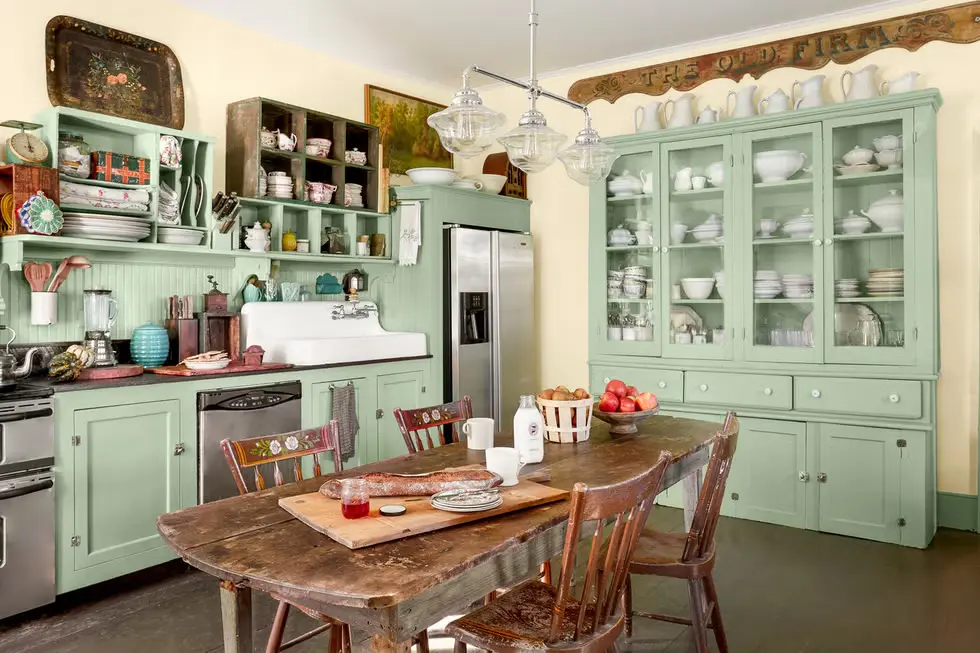 Fresh Celery Green Kitchen Cabinets with a rustic dining table and vintage sink.