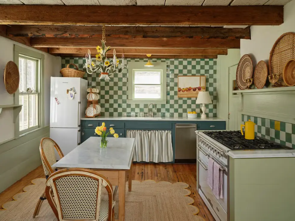 A modern kitchen with Green on Green Cabinets and  checkerboard tile backsplash and Cozy wood tones in kitchen