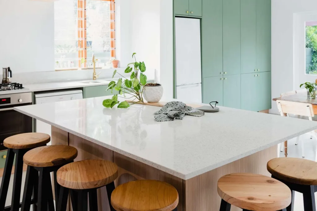 A modern kitchen with white quartz countertop