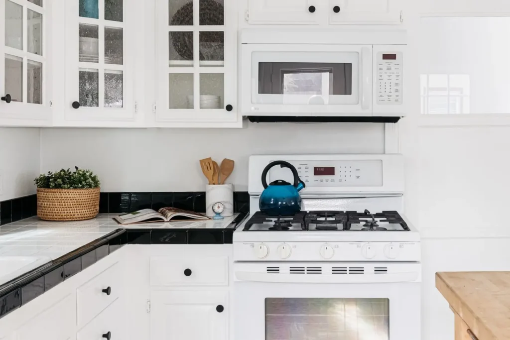 a beautiful kitchen with white Tile Countertop