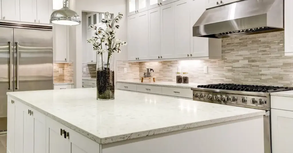 A beautiful kitchen with tiles backsplash and solid surface countertop 