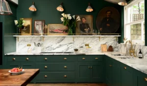 An ultra modern kitchen with green cabinets and white marble backsplash