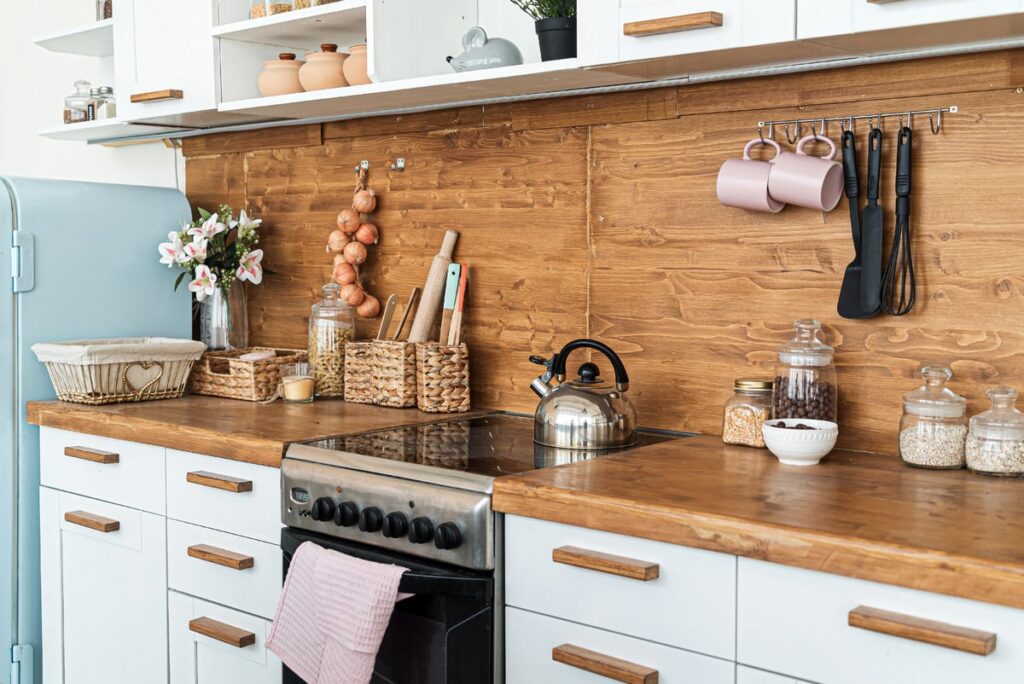 Kitchen with wooden backsplash and wooden countertop