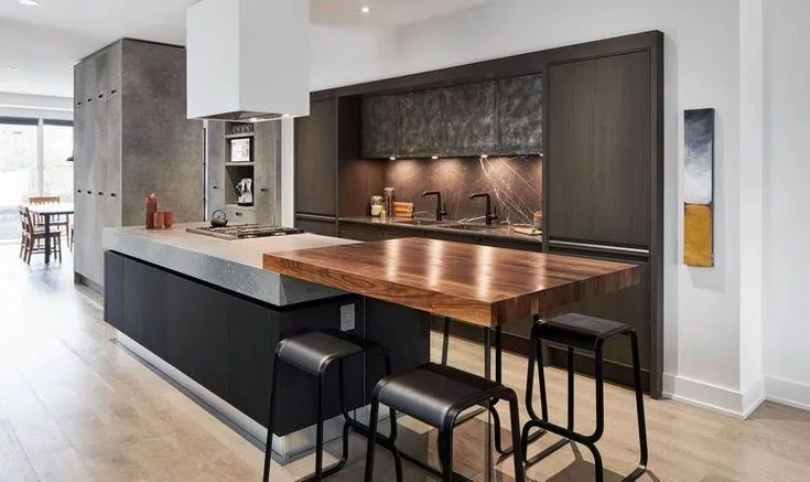 A modern kitchen with wooden island and seating