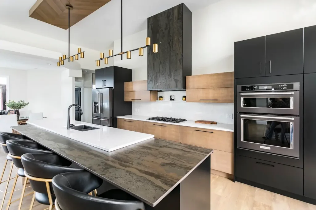 Matte black flat-panel kitchen cabinets with combination of lighter wood cabinets with matte black cabinets